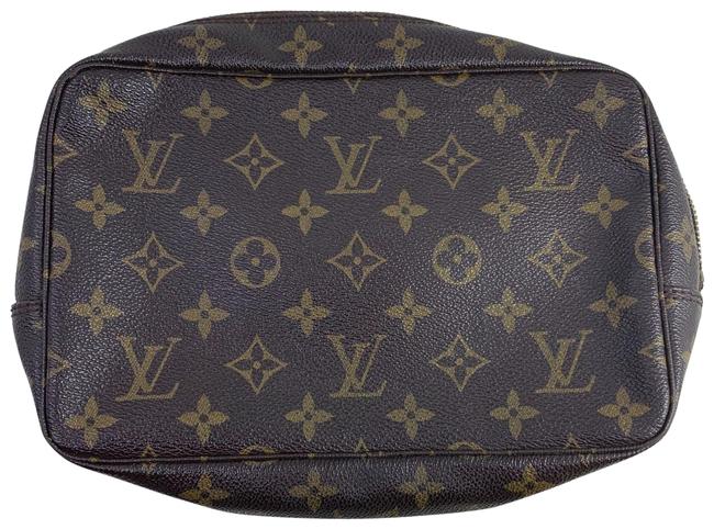 Louis Vuitton Trousse Monogram 23 Brown Clutch