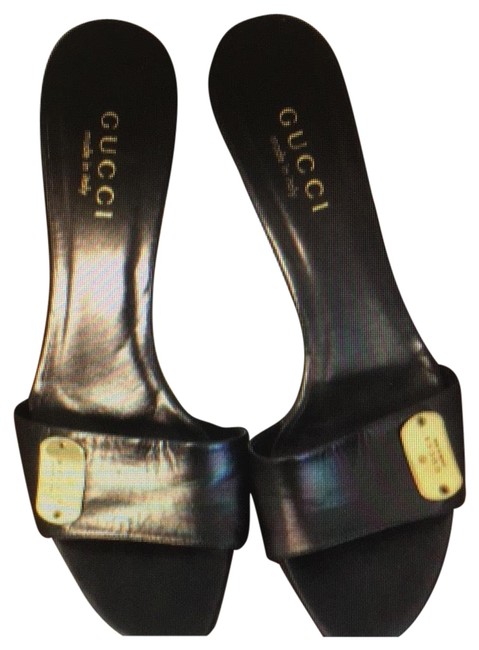 Gucci Black Slippers with Gold Logo. Sandals 