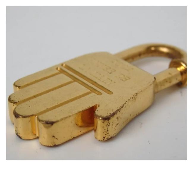 Hermes Annee De La Main Lock Gold Metal Clutch